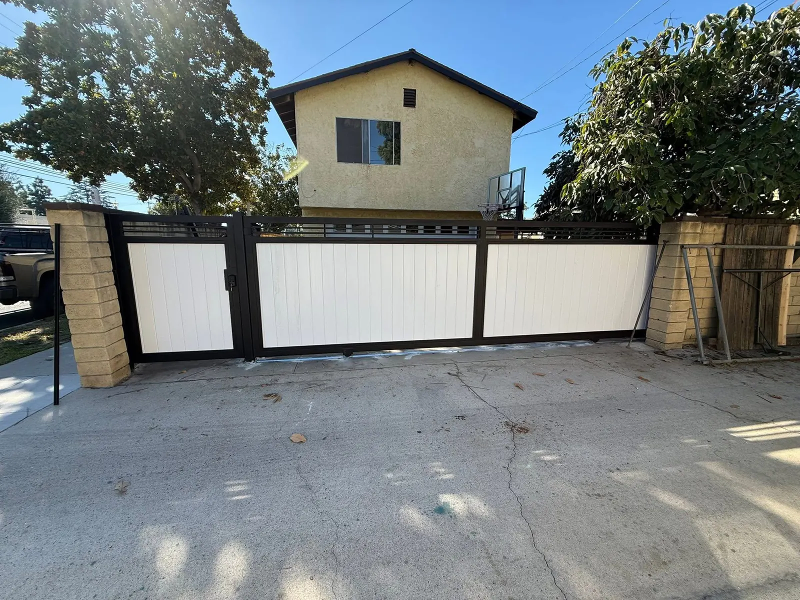Modern Mixed-Metal Driveway Gates