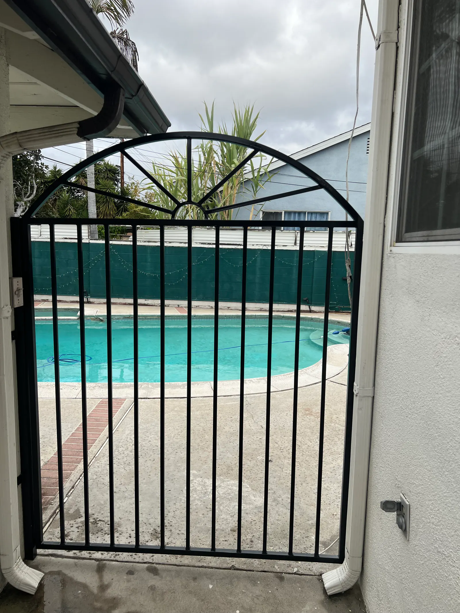 Minimalist Wrought-Iron Pool Fencing